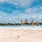 a group of people in swimsuits on a beach
