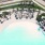 a pool with umbrellas and chairs
