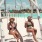 two women sitting on a swing